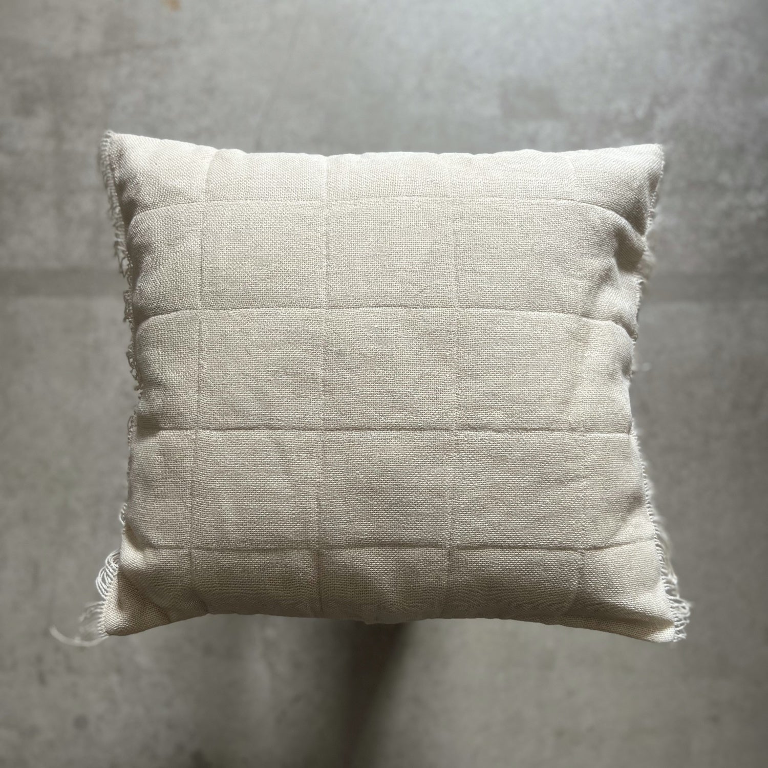 Handcrafted quilted linen cushion in cream 50x50 cm