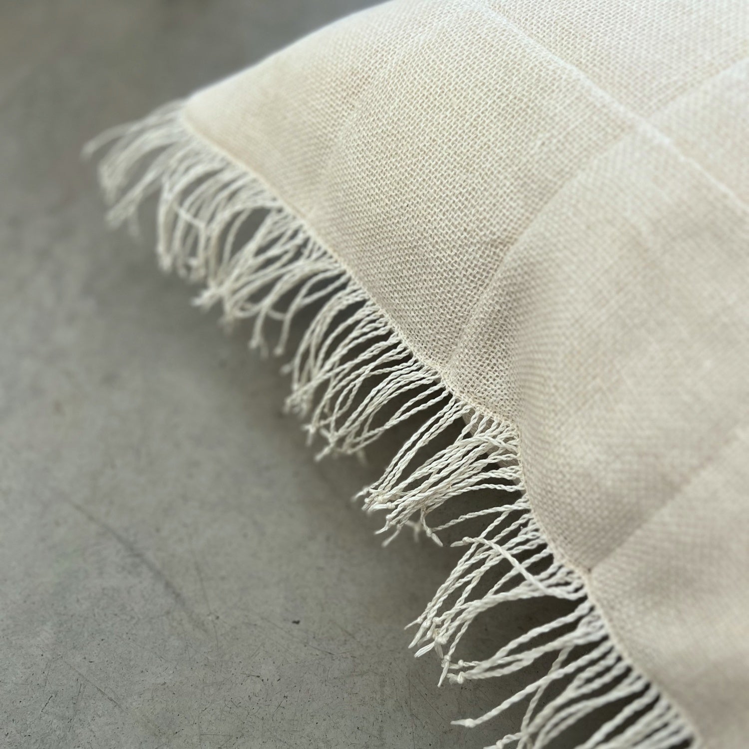 Handcrafted quilted linen cushion in cream 50x50 cm