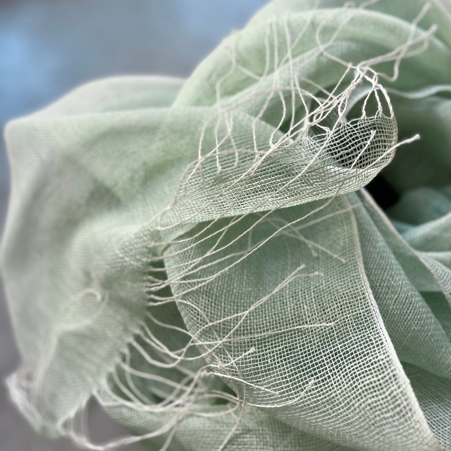 Linen scarf Tinita in mint 70x220 cm with hand twisted fringes