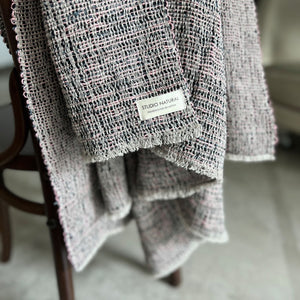 Handwoven boucle linen throw ZM Ieva in mixed colors (natural, black, bluegray and pink) with small fringes 115x205 cm