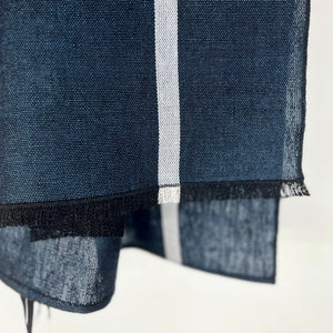 Handwoven linen kitchen towel in ocean blue 50x75 cm with small fringes on one side and decorative white line