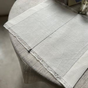 Handwoven Linen Placemat Ieva in white with embroidered black middle line and decorative ends 50x40 cm
