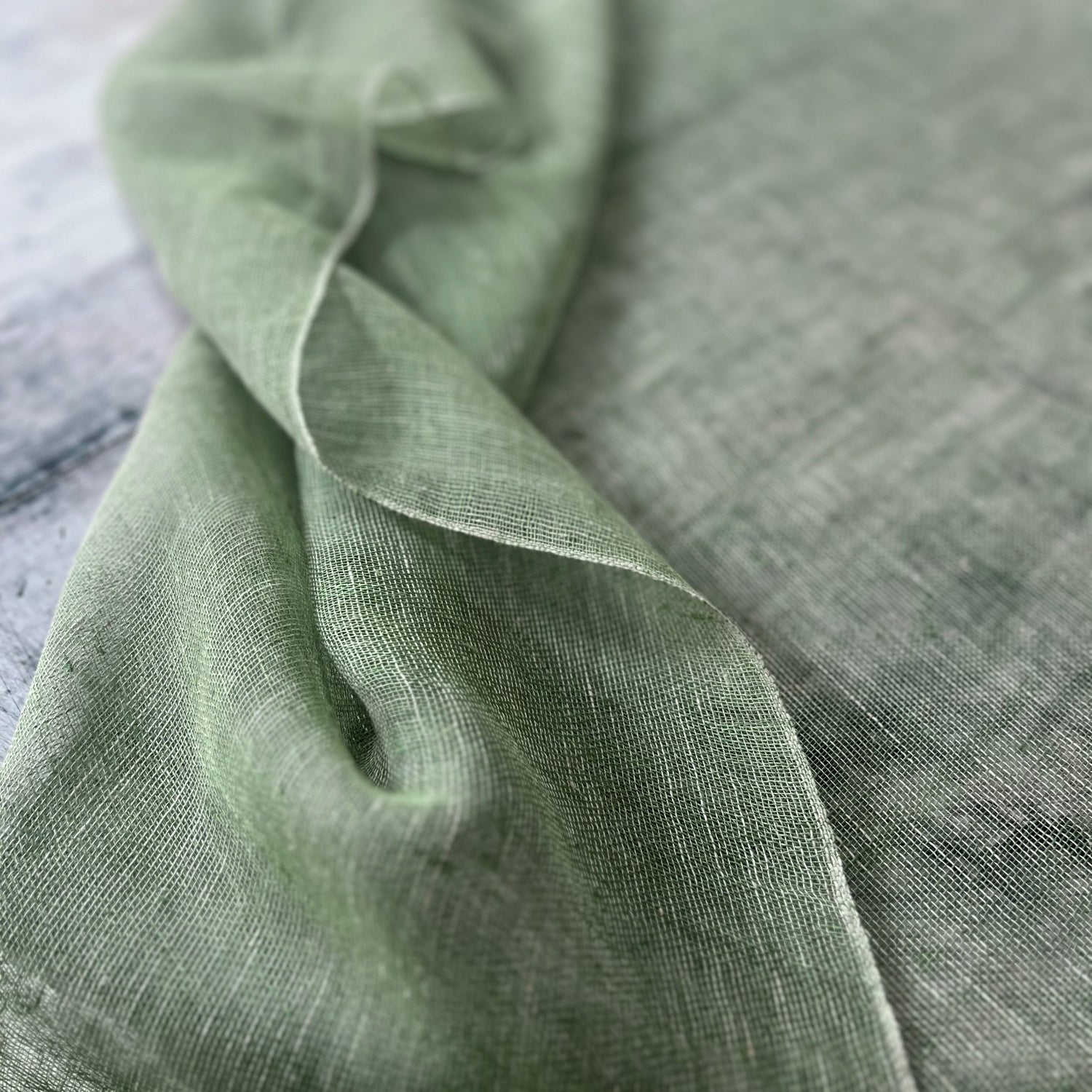 Handwoven sheer linen tablecloth Tinita in green 180x180 cm