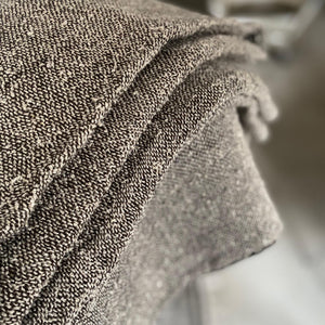 Handmade bouclé linen throw featuring looped linen thread texture in natural linen