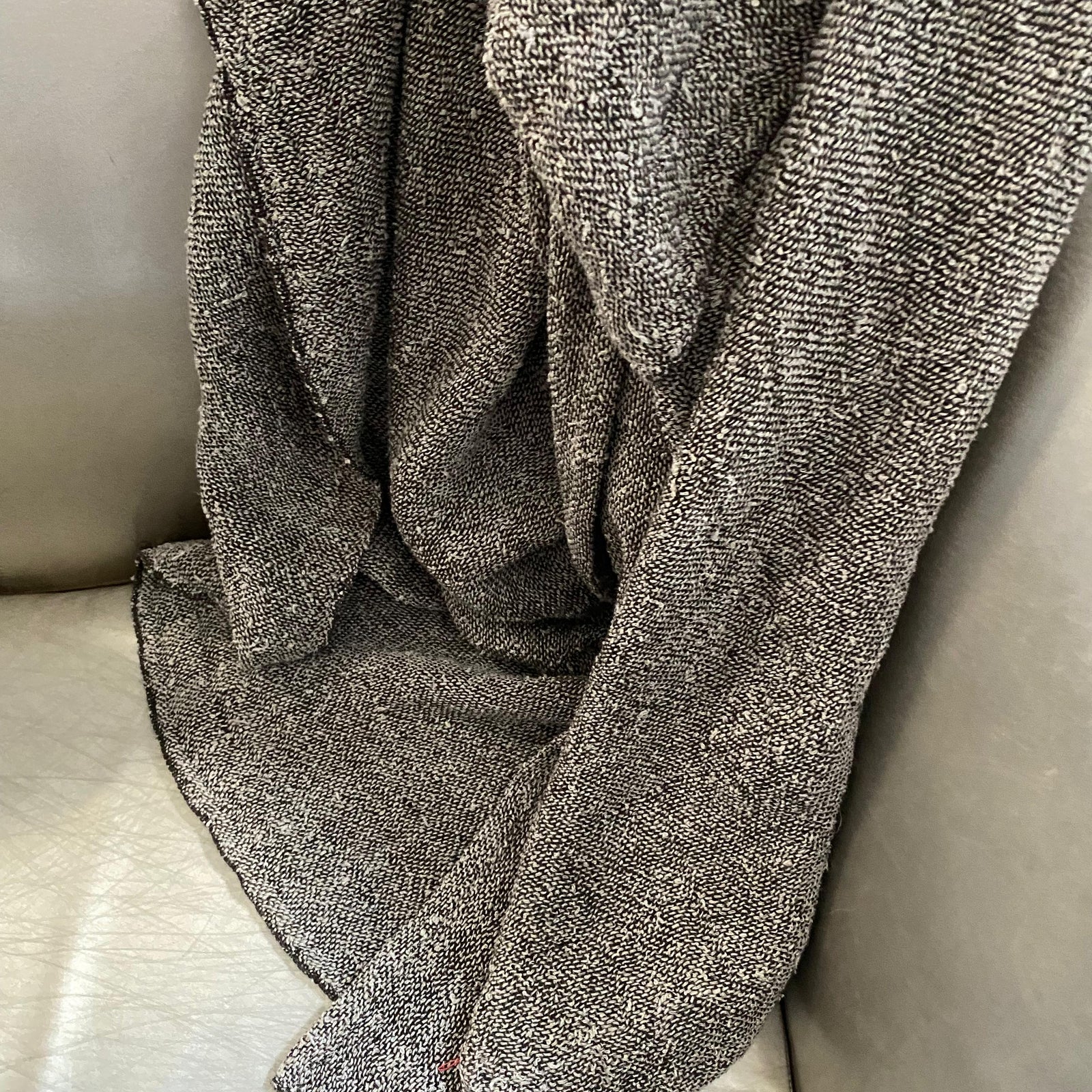 Handmade bouclé linen throw featuring looped linen thread texture in natural linen