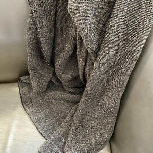 Handmade bouclé linen throw featuring looped linen thread texture in natural linen