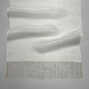 Handwoven linen table runner in white with decorative ends in natural color 50x140 cm