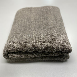 Handmade bouclé linen throw featuring looped linen thread texture in natural linen