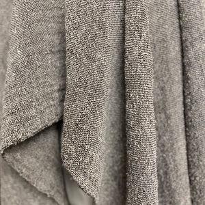 Handmade bouclé linen throw featuring looped linen thread texture in natural linen