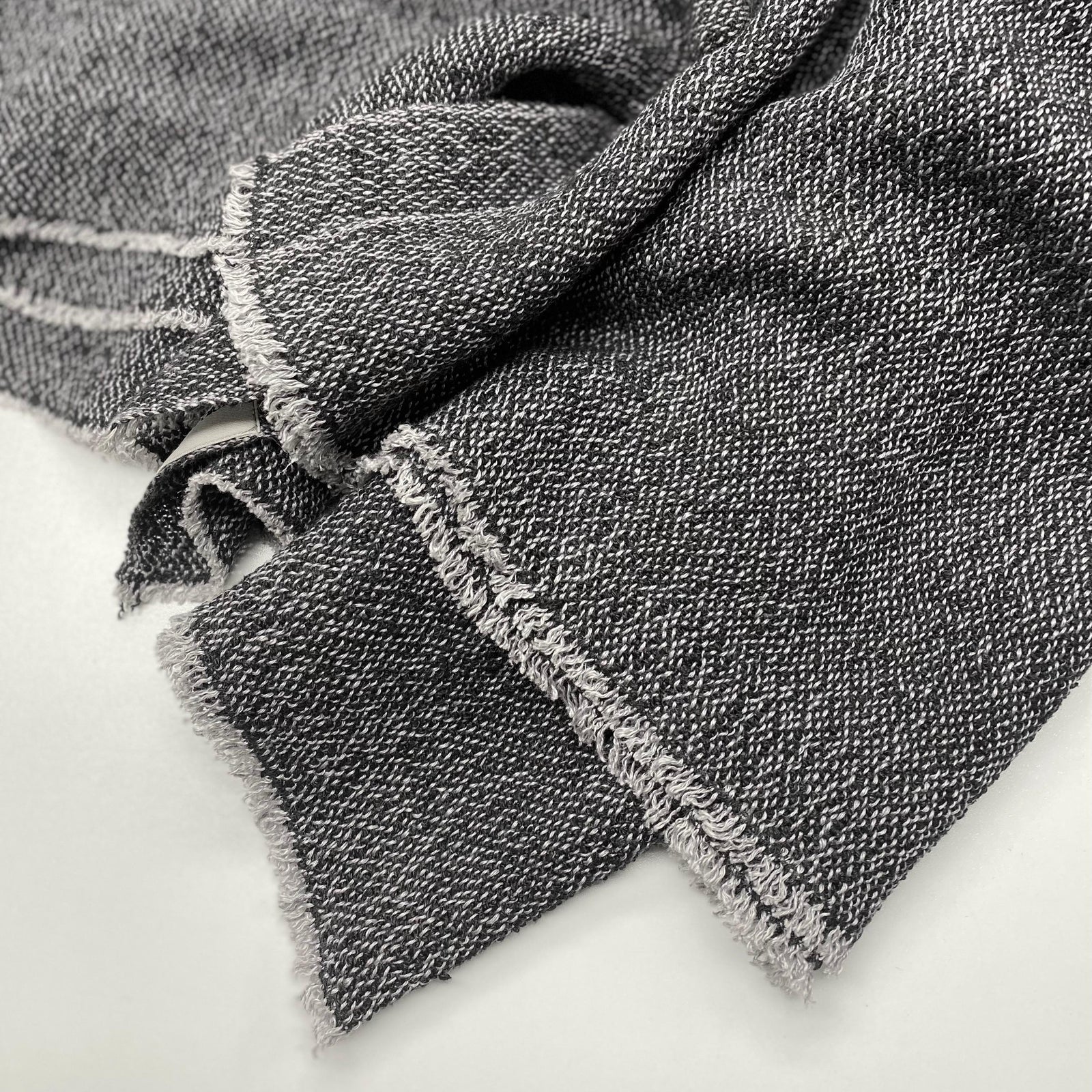 Handmade bouclé linen throw featuring looped linen thread texture in natural linen