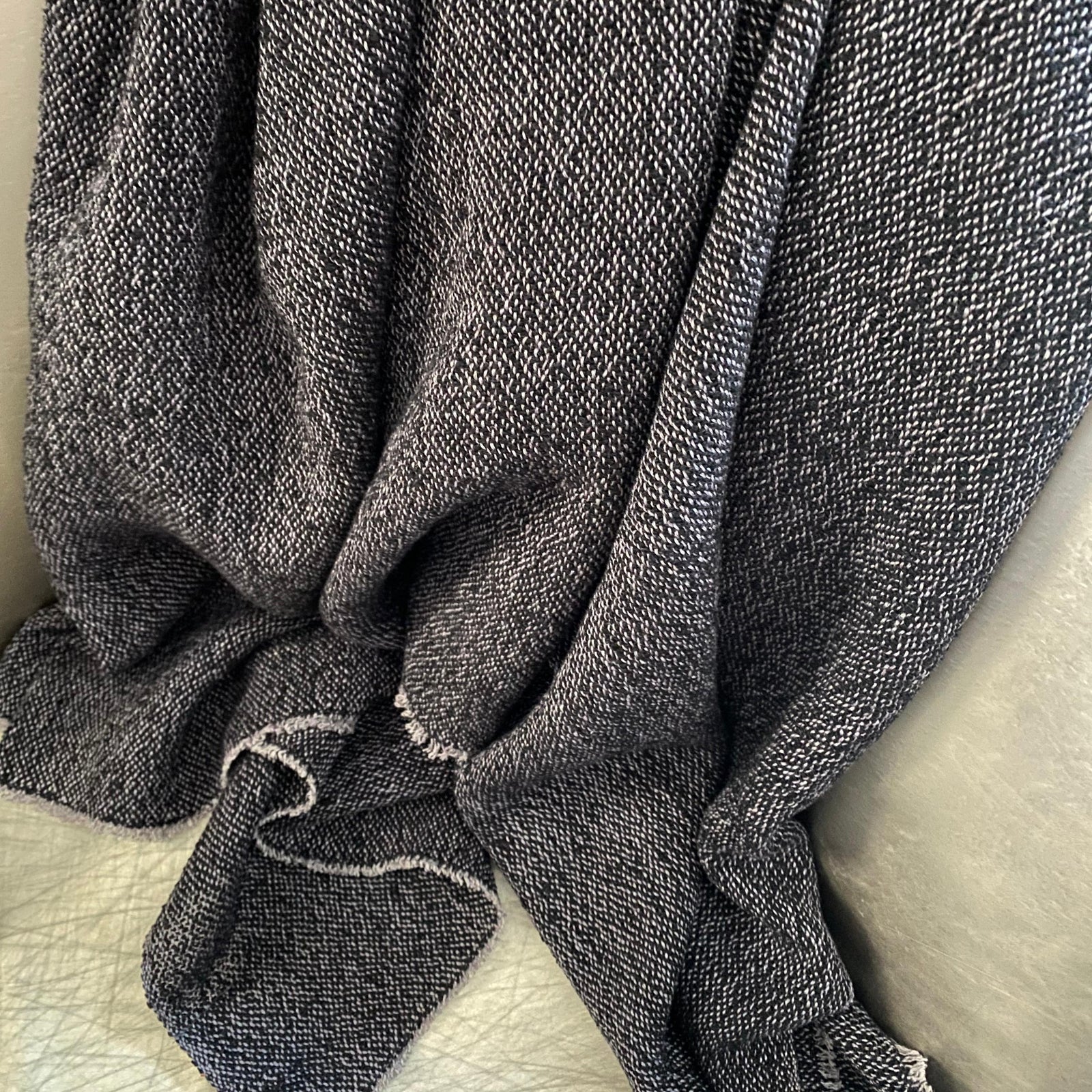 Handmade bouclé linen throw featuring looped linen thread texture in natural linen