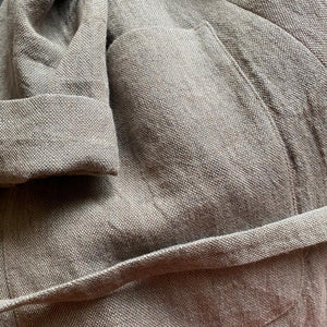 Hand woven linen coat in cool beige.