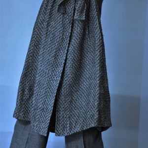 Hand woven linen coat with silk lining and fur on the cuffs in anthracite grey