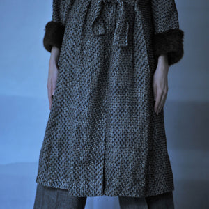 Hand woven linen coat with silk lining and fur on the cuffs in anthracite grey