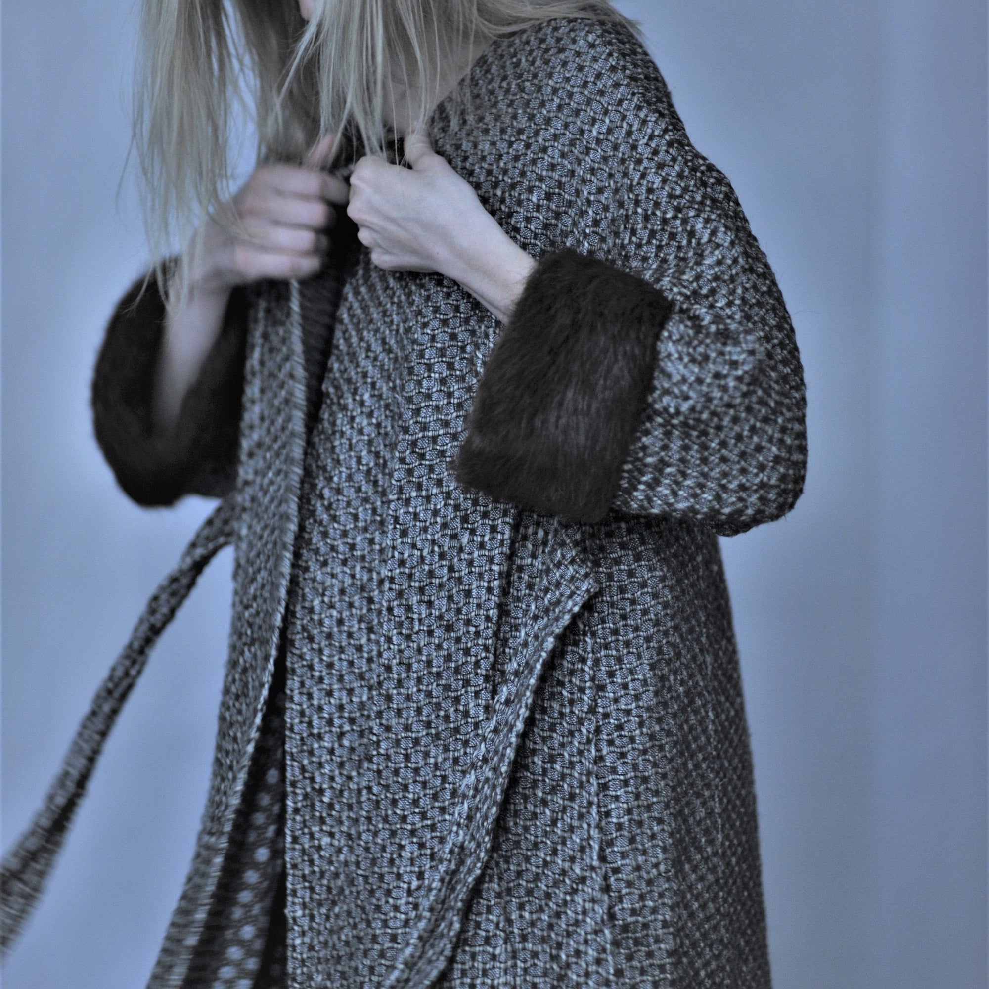 Hand woven linen coat with silk lining and fur on the cuffs in anthracite grey