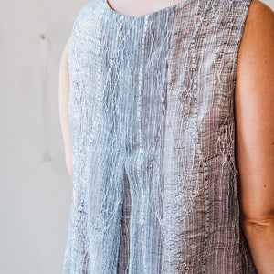 Hand woven and embroidered sleeveless linen dress in grey and white