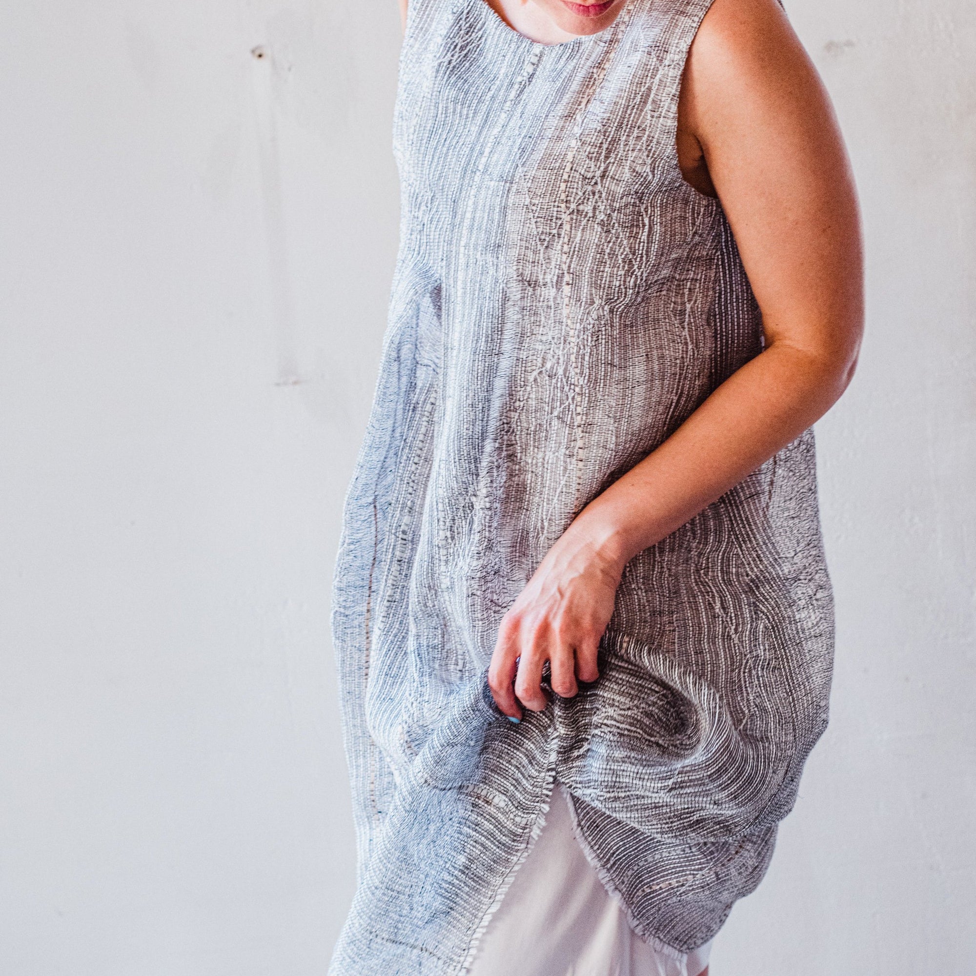 Hand woven and embroidered sleeveless linen dress in grey and white