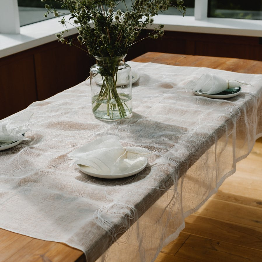 Embroidered linen tablecloth in white 180x125 cm
