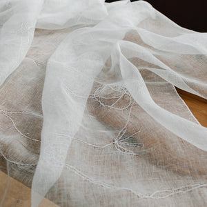 Embroidered linen tablecloth in white 180x125 cm